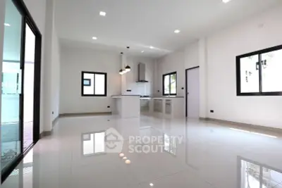 Spacious modern kitchen with sleek design and ample natural light