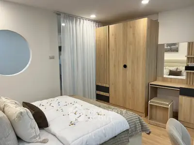 Cozy bedroom with modern wooden furniture and soft lighting