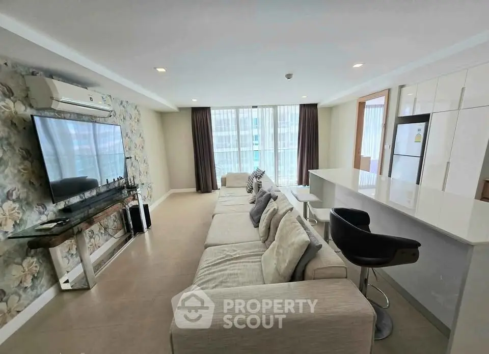 Spacious modern living room with open kitchen and stylish decor