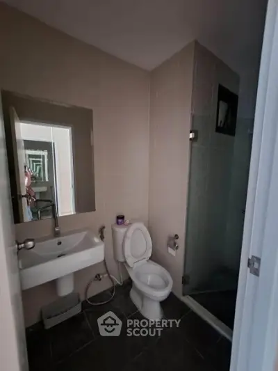Modern bathroom with sleek fixtures and glass shower enclosure