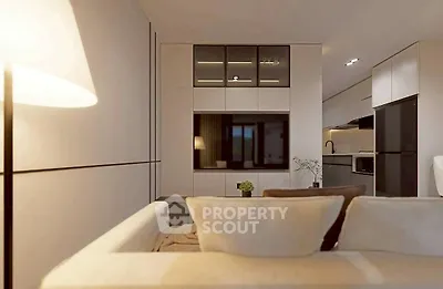 Modern living room with sleek design and integrated kitchen area