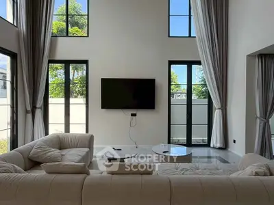 Luxurious modern living room with high ceilings and elegant decor
