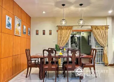 Elegant dining room with wooden accents and stylish lighting