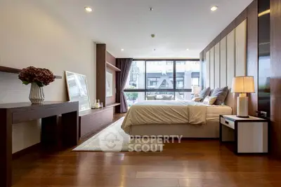 Luxurious modern bedroom with elegant decor and large window view