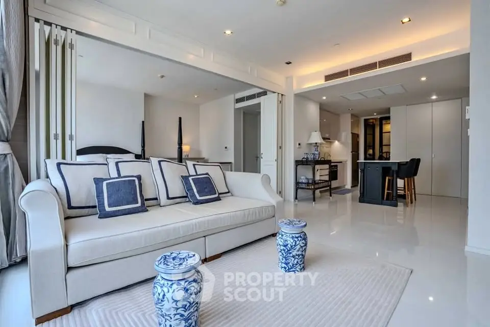 Luxurious open-plan living room with elegant decor and modern kitchen
