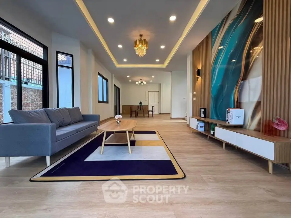 Spacious modern living room with elegant decor and stylish lighting