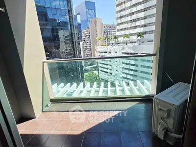 Modern balcony with city view in high-rise building, perfect for urban living.