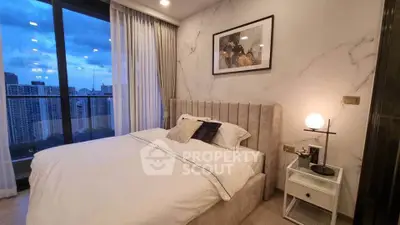 Luxurious bedroom with stunning city view and elegant decor
