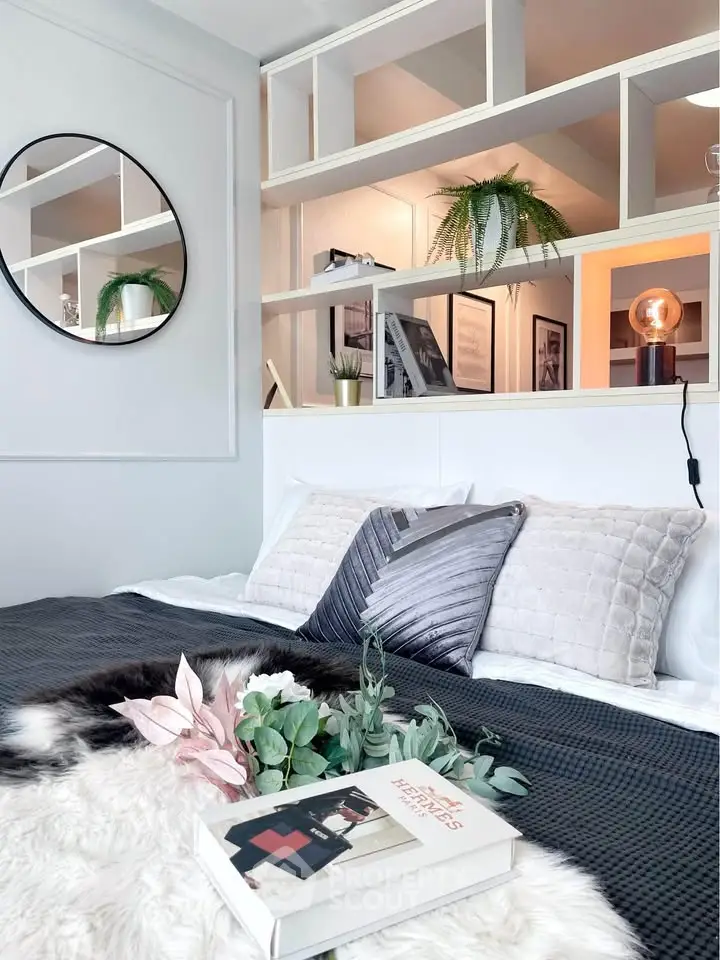 Stylish modern bedroom with elegant decor and cozy bedding