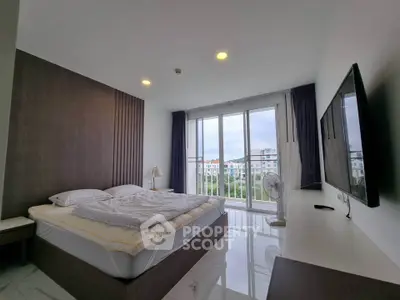 Modern bedroom with large window and city view, featuring sleek furniture and minimalist design.