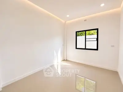 Bright empty room with glossy tiled floor and large window, perfect for customization.