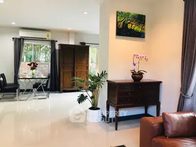 Spacious living room with elegant furniture and natural light, perfect for modern living.