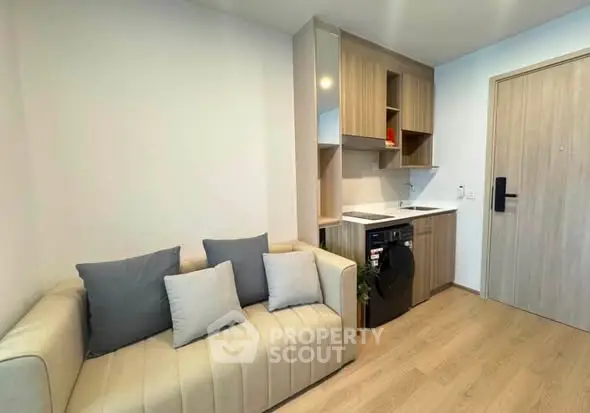Modern compact living room with integrated laundry and stylish decor