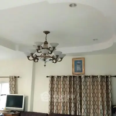 Elegant living room with chandelier and modern decor