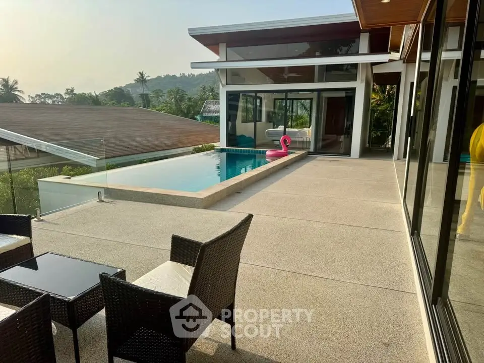Luxurious modern villa with stunning pool and mountain view, perfect for relaxation and entertaining.