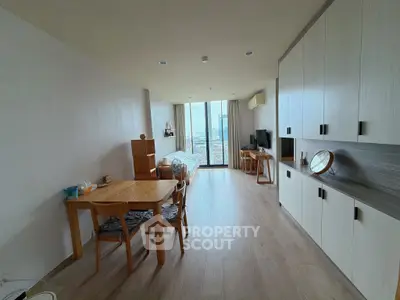 Spacious modern living room with wooden furniture and city view