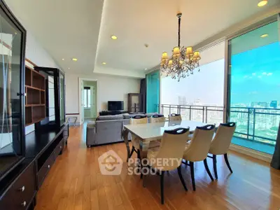 Luxurious living room with elegant dining area and stunning city view from large windows.