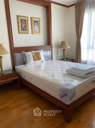 Cozy bedroom with elegant wooden furniture and natural light