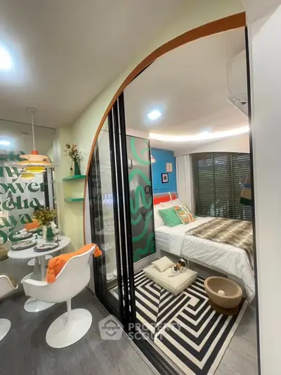 Modern studio apartment with stylish decor and cozy bedroom area