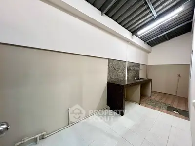 Spacious kitchen area with modern sink and ample counter space
