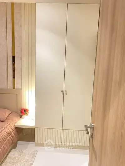 Cozy bedroom with modern wardrobe and soft lighting