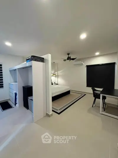 Modern bedroom with sleek design, featuring a cozy bed, stylish furniture, and ambient lighting for ultimate comfort.