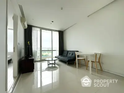 Spacious and bright living room with modern furniture, gleaming floors, and a large window offering an expansive view, perfect for urban living.