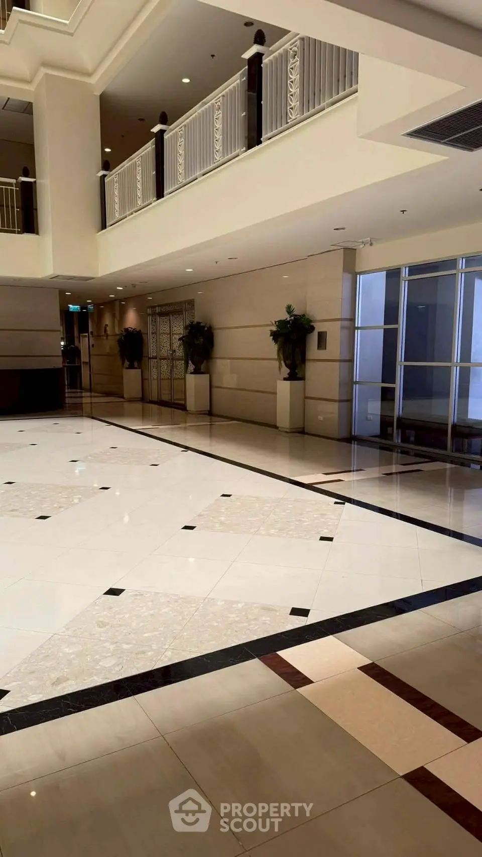 Luxurious building lobby with elegant marble flooring and modern design.