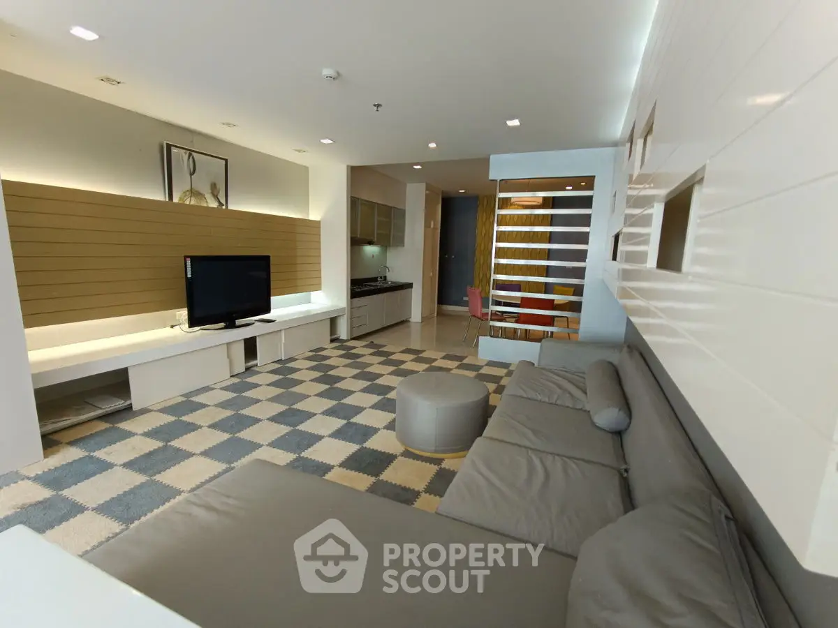 Modern living room with stylish decor and open kitchen layout