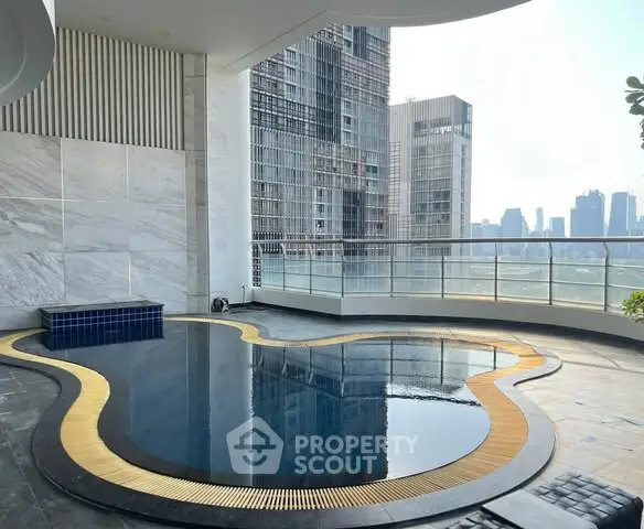 Luxurious rooftop pool with stunning city skyline view, perfect for relaxation and entertainment.