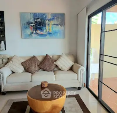 Stylish living room with modern art and cozy seating area