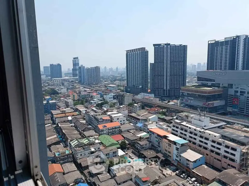 Stunning cityscape view from high-rise building overlooking urban skyline.