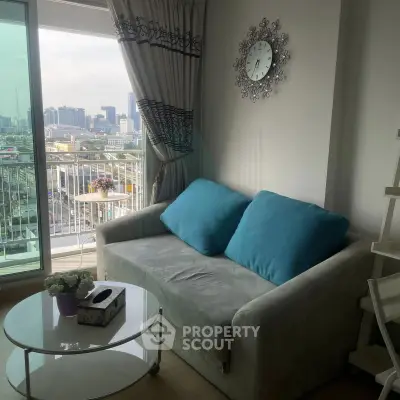 Charming living room with city view, cozy sofa, and elegant decor in modern apartment.