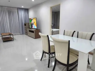 Spacious modern living room with elegant dining area and sleek furniture