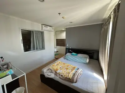 Cozy bedroom with natural light and modern decor