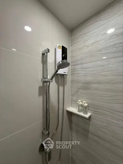 Modern bathroom shower with sleek design and built-in shelf