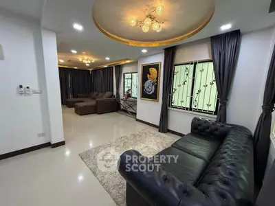 Luxurious living room with elegant decor and plush seating in a modern home.