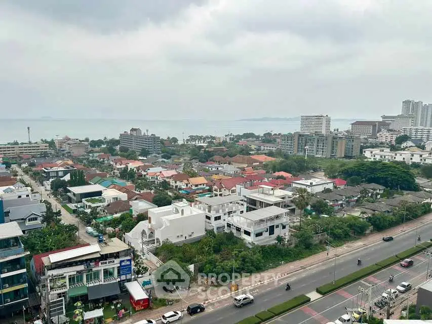 Stunning cityscape view with ocean backdrop and modern buildings.