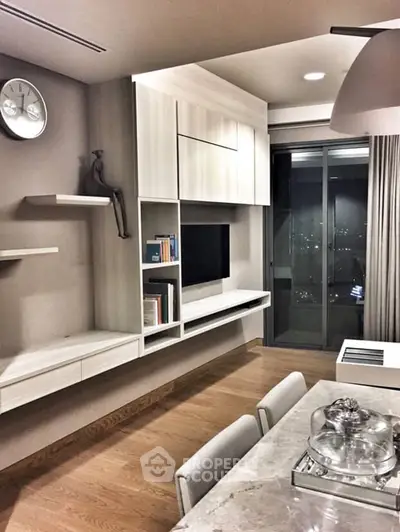 Modern living room with sleek built-in shelves and city view