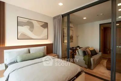 Modern bedroom with cozy living area and stylish decor