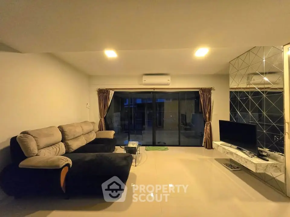 Spacious living room with modern decor and large sectional sofa
