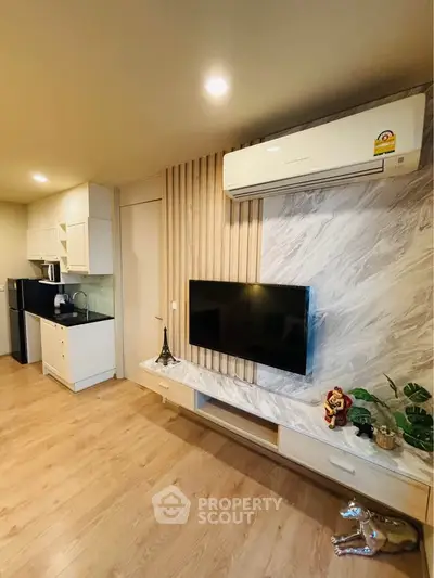 Modern living room with stylish decor and open kitchen layout