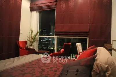 Luxurious bedroom with elegant red decor and city view