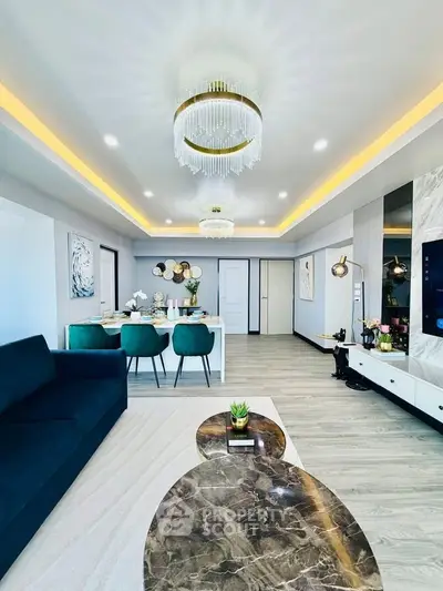 Luxurious modern living room with elegant chandelier and stylish decor