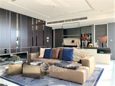 Luxurious open-plan living space with sleek modern furniture, integrated kitchen, and high-end finishes, perfect for upscale urban living.