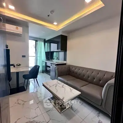 Modern living room with elegant marble flooring and stylish furniture in a contemporary apartment.