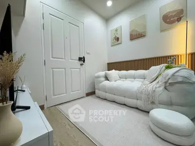 Cozy modern living room with plush white sofa and stylish decor