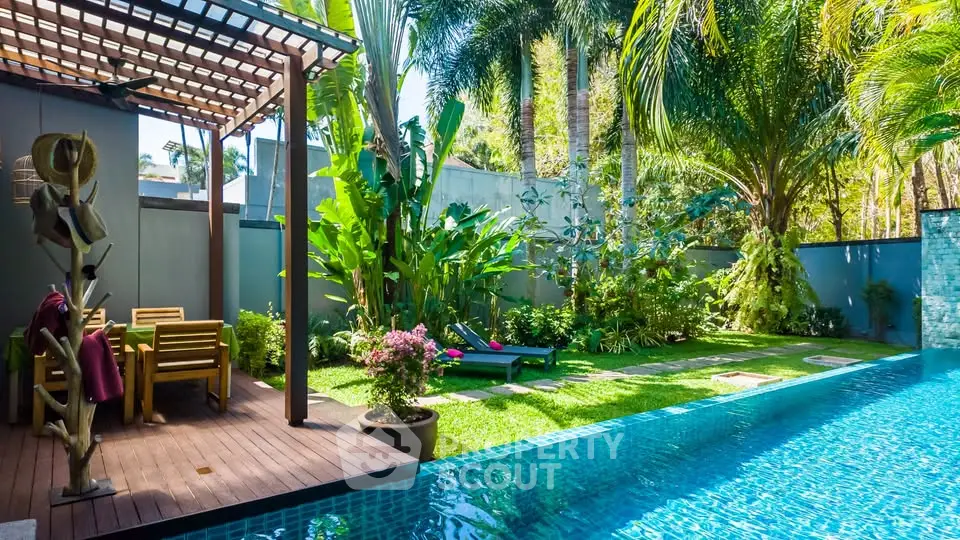 Luxurious tropical backyard with sparkling pool and lush garden oasis