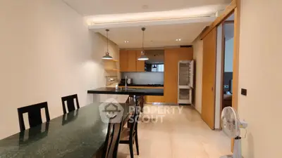 Modern kitchen with sleek dining area and open layout design