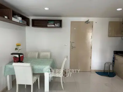 Cozy dining area with modern furniture and minimalist decor in a bright apartment.